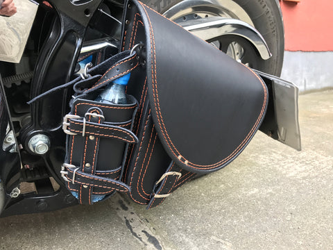 Diablo Orange swing bag with bottle cage fits Harley-Davidson Softail